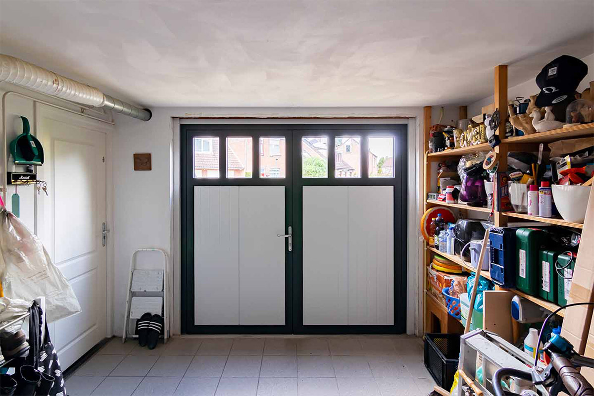 openslaande garagedeur onderhoudsarm